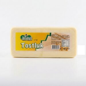 Packaged cheese block in a clear plastic wrapper with a bright yellow label reading 'Tostluk' on a white background, 700 g e